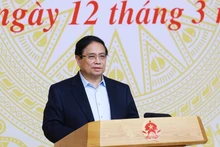 Le Premier ministre Pham Minh Chinh s’exprime lors de la deuxième réunion du Comité directeur national sur l’inclusion financière, à Hanoi, le 12 mars. Photo : VNA.