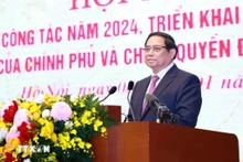 Le Premier ministre Pham Minh Chinh prend la parole lors de la conférence. Photo : VNA.