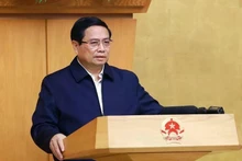 Le Premier ministre Pham Minh Chinh préside la réunion périodique de janvier du gouvernement. Photo : VNA. 