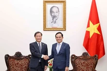 Le Vice-PM vietnamien Trân Luu Quang (à droite) et le vice-président exécutif senior de l'Agence japonaise de Coopération internationale (JICA), Yamada Junichi. Photo : VNA.