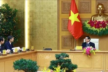 Le Premier ministre Pham Minh Chinh reçoit Chen Gang, membre du Comité central du Parti communiste chinois (PCC), secrétaire du Comité du PCC et président du Comité permanent de l'Assemblée populaire de la région autonome Zhuang du Guangxi, Chine. Photo : VNA. 