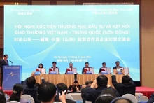 Conférence sur la promotion du commerce, de l’investissement entre le Vietnam et la province chinoise du Shandong. Photo : VNA.