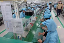 Ces derniers temps, la quantité et la qualité des entreprises vietnamiennes spécialisées dans les industries auxiliaires se sont considérablement améliorées. Photo: VNA.