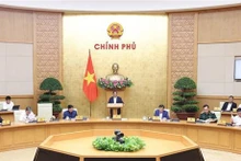 Le Premier ministre Pham Minh Chinh a présidé la réunion thématique de mars 2024 du gouvernement sur la préparation de lois. Photo : VNA.