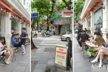 Un espace de lecture du journal Nhân Dân évoque la nostalgie : café sur le trottoir et journaux imprimés. Photo : NDEL.
