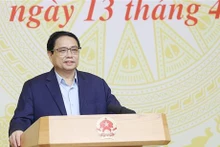 Le Premier ministre Pham Minh Chinh lors de la conférence, à Hanoi, le 13 avril. Photo : VNA
