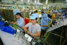 2024 devrait être une année où le Vietnam continuera d'attirer d’importants capitaux d’investissement étrangers. Photo : VNA.
