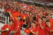 La joie des joueurs et supporters vietnamiens. Photo: VNA