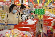 Les produits vietnamiens représentaient plus de 90% des produits distribués par les entreprises nationales. Photo : VNA