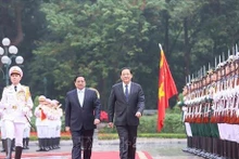Le Premier ministre Pham Minh Chinh (à gauche) et son homologue lao, Sonexay Siphandone. Photo : VNA.