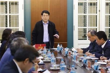 Le président de la République, Luong Cuong (debout), lors de la séance de travail. Photo: VNA 
