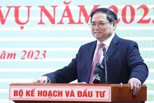 Le Premier ministre Pham Minh Chinh s’adressant à la conférence hybride au siège du MPI à Hanoi avec 63 provinces et villes. Photo : VNA