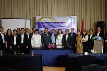 Les délégués lors de la cérémonie de signature de mémorandum de coopération. Photo: baoquocte.vn