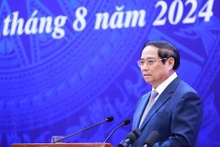 Le Premier ministre Pham Minh Chinh s'exprime lors de la visioconférence. Photo: VNA