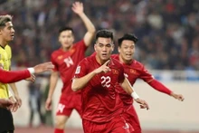 Des joueurs vietnamiens lors du match. Photo : VNA.