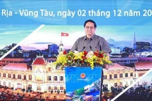 Le Premier ministre Pham Minh Chinh lors de la conférence. Photo : VNA.