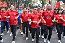 [En images] À Hanoï, la course olympique rassemble des milliers de participants