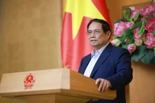 Le Premier ministre Pham Minh Chinh lors de la réunion, à Hanoï, le 9 juillet. Photo : VNA.