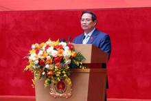 Le Premier ministre Pham Minh Chinh s’adresse à la conférence, à Hanoï, le 12 novembre. Photo : VNA.