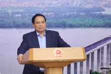 Le Premier ministre vietnamien Pham Minh Chinh préside la 21e réunion du Comité national de pilotage des ouvrages et projets clés du secteur des transports. Photo : VNA.