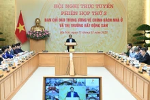[En images] Le PM Pham Minh Chinh préside une réunion sur les politiques de logement et le marché immobilier