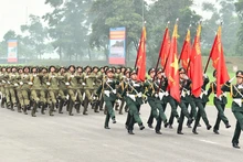 L’Armée populaire avance résolument sous le drapeau glorieux du Parti