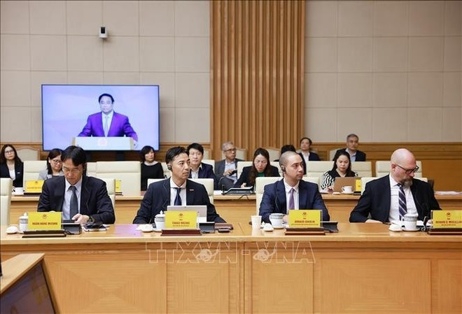 Des délégués participant à la conférence de consultation avec des experts et des organisations nationales et internationales sur la création d’un centre financier international au Vietnam. Photo: VNA