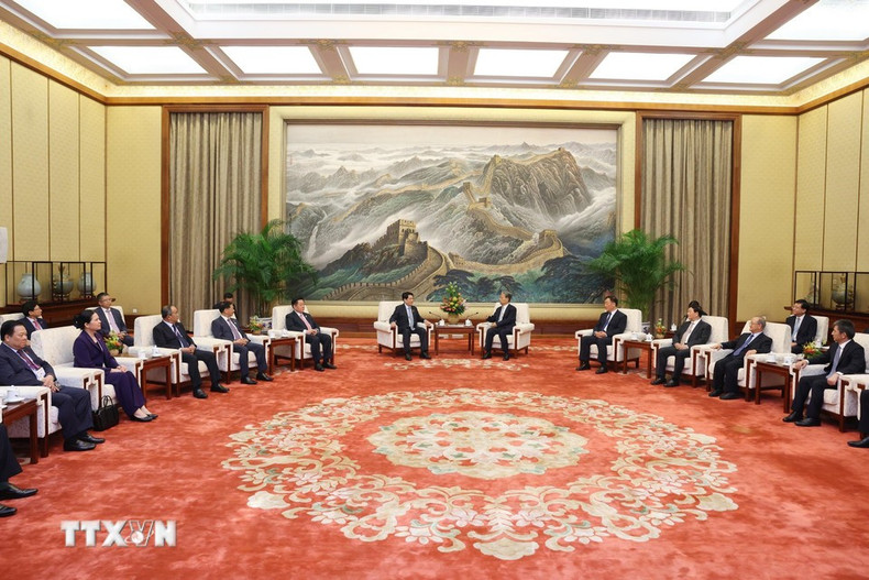 Lors de la rencontre. Photo : VNA chu-tich-nuoc-luong-cuong-hoi-kien-uy-vien-truong-nhan-dai-toan-quoc-trung-quoc-trieu-lac-te-8256587-6.jpg