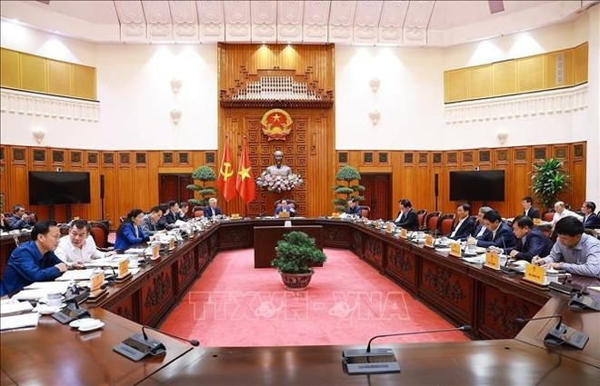 Lors de la réunion. Photo : VNA