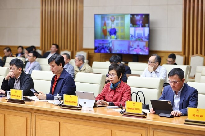 Des membres du Comité directeur national de la défense civile à la réunion. Photo: VNA