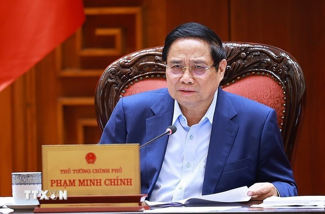 Le Premier ministre Pham Minh Chinh lors de sa réunion avec les vice-Premiers ministres et les dirigeants des ministères et agences gouvernementales. Photo : VNA