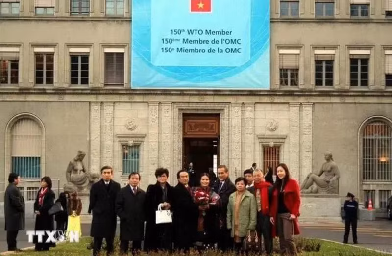 Le 11 janvier 2007, les droits et obligations du Vietnam en tant que membre de l'OMC sont officiellement entrés en vigueur. Photo : VNA.