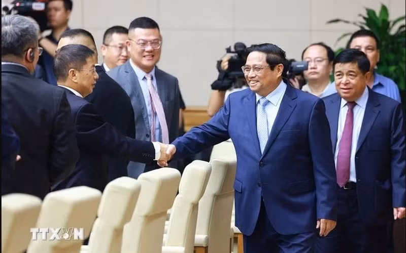 Le Premier ministre Pham Minh Chinh rencontre des entreprises chinoises. Photo : VNA.