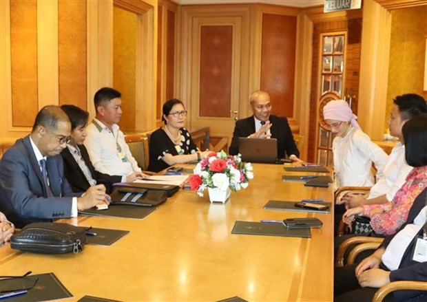 Vue de la cérémonie d’annonce du modèle de coopération des villes jumelles, à Kuala Lumpur, le 8 août. Photo : VNA
