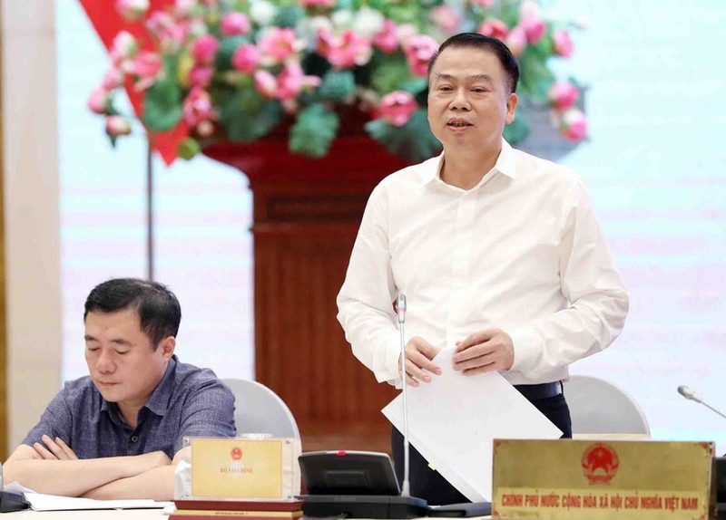 Le vice-ministre des Finances, Nguyen Duc Chi, s'exprime lors de la conférence de presse. Photo : VNA.