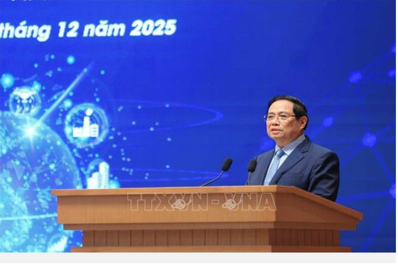 Le Premier ministre Pham Minh Chinh au IIIᵉ Forum national sur le développement de l’économie et de la société numériques, organisé en présentiel et en ligne avec les 34 villes et provinces. Photo : VNA.