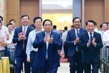 Le Premier ministre Pham Minh Chinh a présidé une conférence nationale en ligne le 22 juin afin d'examiner les programmes nationaux ciblés pour la construction de Nouvelle ruralité et la réduction durable de la pauvreté. Photo : VNA.