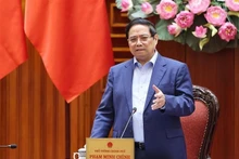 Le Premier ministre Pham Minh Chinh préside une réunion de la Permanence du gouvernement visant à évaluer la situation et à mettre en œuvre de mesures urgentes pour remédier aux conséquences du typhon n°11 (Matmo) et des inondations qui ont suivi. Photo : VNA.