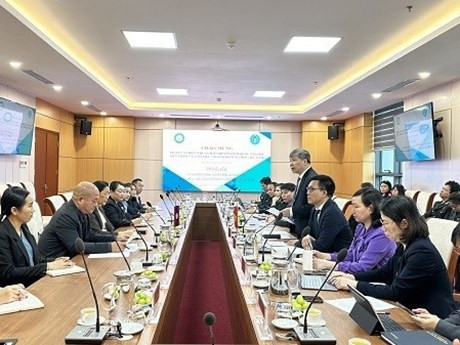 La séance de travail entre les représentants de la Sécurité sociale du Vietnam (VSS) et ceux de l'Organisation laotienne de Sécurité sociale (OSSL). Photo: laodong.vn.