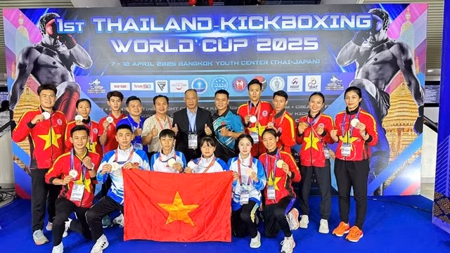 Athlètes et entraîneurs vietnamiens lors du tournoi. Photo : VNA.