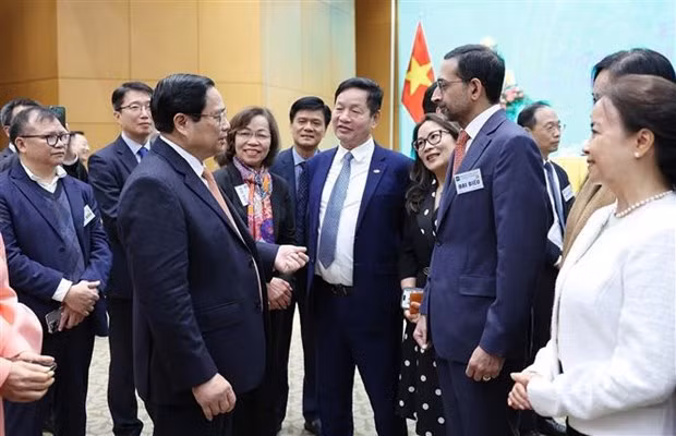 Le Premier ministre Pham Minh Chinh et les délégués lors de la conférence. Photo : VNA.