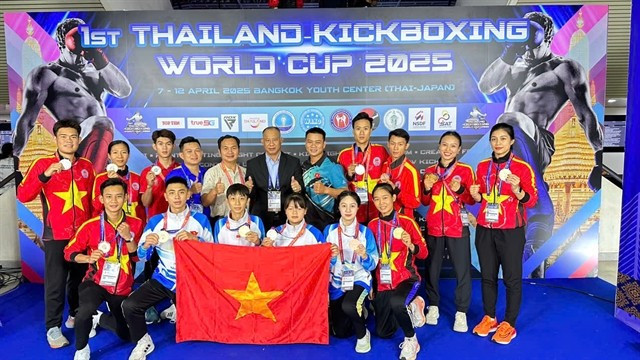 Athlètes et entraîneurs vietnamiens lors du tournoi. Photo : VNA.
