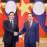 Le président de l'Assemblée nationale du Vietnam, Tran Thanh Man (droite), et le Premier ministre lao, Sonexay Siphandone. Photo : VNA.