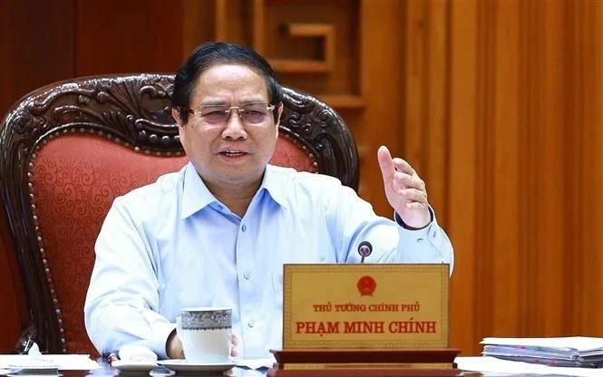 Le Premier ministre Pham Minh Chinh s’exprime lors de la réunion, à Hanoi, le 22 avril. Photo : VNA. 