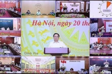 Le Premier ministre Pham Minh Chinh lors de la conférence, à Hanoi, le 20 août. Photo : VNA.