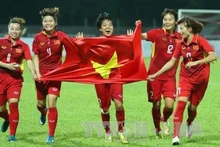 Les Vietnamiennes célèbrent leur 5ème victoire aux SEA Games. Photo: VNA.