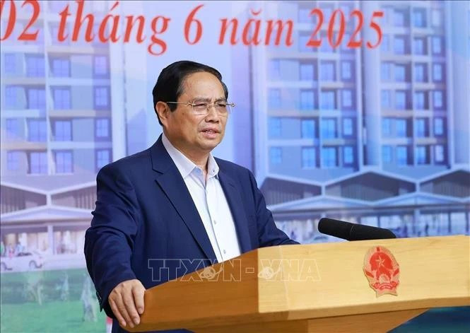 Le Premier ministre Pham Minh Chinh s'exprime lors de la conférence. Photo: VNA