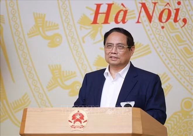 Le Premier ministre Pham Minh Chinh s'exprime lors de la conférence. Photo : VNA.