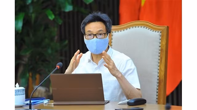 Le Vice-Premier ministre Vu Duc Dam s'exprime lors de l'événement, le 14 mai à Hanoï. Photo : VNA.
